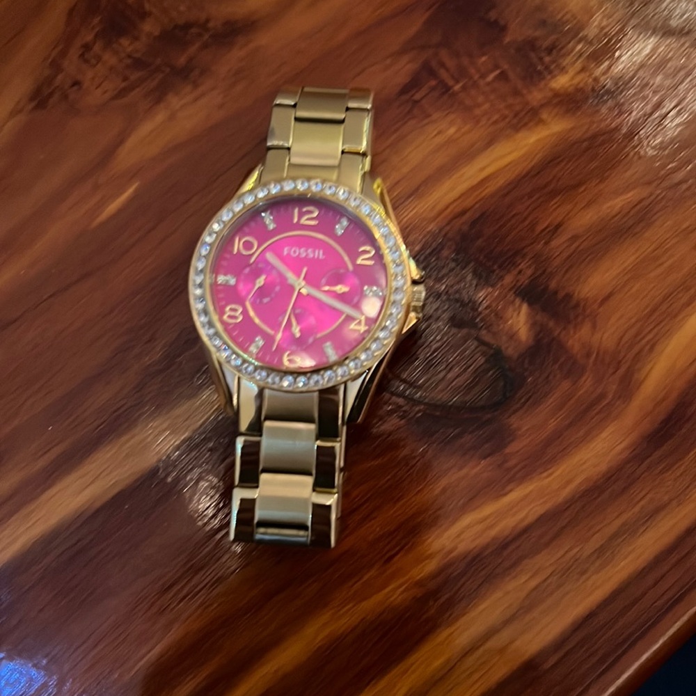 Gold Fossil Watch with Pink Face.